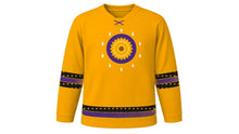 Load image into Gallery viewer, All Souls' Day Original Hockey Jersey in Marigold Orange, front view – a marigold blossom medallion ringed by small glowing candles on the chest and candle-glow dotted sleeve and hem stripes – custom name and number