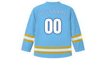 Load image into Gallery viewer, Assumption Day Original Hockey Jersey in Sky Blue, back view with wave-pattern sleeve and hem stripes and your name and number