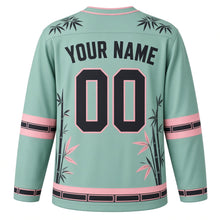 Load image into Gallery viewer, Bamboo Panda Grove Original Hockey Jersey in Misty Jade, back view with your name and number – bamboo-leaf yoke and bamboo-node sleeve stripes