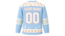 Load image into Gallery viewer, Bunny Carrot Patch Original Hockey Jersey in Meadow Sky, back view with your name and number – carrot-and-daisy yoke and gingham sleeve bands