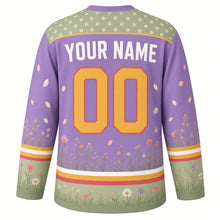 Load image into Gallery viewer, Butterfly Meadow Original Hockey Jersey in Lavender Field, back view with your name and number – daisy-dot yoke and grass-and-wildflower hem stripes