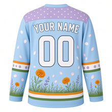 Load image into Gallery viewer, Butterfly Meadow Original Hockey Jersey in Sky Meadow, back view with your name and number – daisy-dot yoke and grass-and-wildflower hem stripes