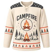 Load image into Gallery viewer, Campfire Starry Night Original Hockey Jersey in Birch Cream, front view – crackling campfire with tents and pines under the stars with campfire crest, custom name and number