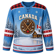Load image into Gallery viewer, Canada Frozen Pond Legacy Original Hockey Jersey in Pond Ice Blue, front view – frozen pond, log cabin, snowy pines, crossed wooden sticks and a small Canadian flag, custom name and number