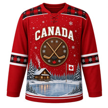 Load image into Gallery viewer, Canada Frozen Pond Legacy Original Hockey Jersey in Cabin Red, front view – frozen pond, log cabin, snowy pines, crossed wooden sticks and a small Canadian flag, custom name and number