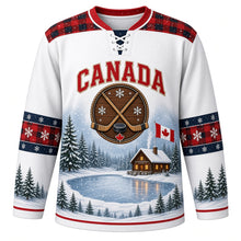 Load image into Gallery viewer, Canada Frozen Pond Legacy Original Hockey Jersey in Snowfall White, front view – frozen pond, log cabin, snowy pines, crossed wooden sticks and a small Canadian flag, custom name and number