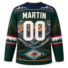 Load image into Gallery viewer, Canada Rocky Mountain Majesty Original Hockey Jersey in Spruce Green, back view with your name and number – mountain-peak yoke, pine-pattern sleeve stripes and glacier hem