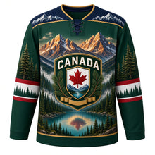 Load image into Gallery viewer, Canada Rocky Mountain Majesty Original Hockey Jersey in Spruce Green, front view – layered Rocky Mountain peaks, glacier lake, pines and maple-leaf shield crest, custom name and number