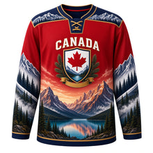 Load image into Gallery viewer, Canada Rocky Mountain Majesty Original Hockey Jersey in Alpine Red, front view – layered Rocky Mountain peaks, glacier lake, pines and maple-leaf shield crest, custom name and number