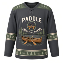 Load image into Gallery viewer, Canoe Mountain Lake Original Hockey Jersey in Pine Charcoal, front view – wooden canoe with crossed paddles on a calm mountain lake with canoe crest, custom name and number
