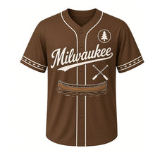 Load image into Gallery viewer, Canoe Portage Milwaukee Baseball Jersey in Paddle Brown, front view – wooden canoe with crossed paddles graphic with pine-tree crest, custom name and number