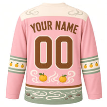 Load image into Gallery viewer, Capybara Hot Spring Original Hockey Jersey in Blossom Pink, back view with your name and number – steam-swirl yoke and yuzu-dot sleeve bands