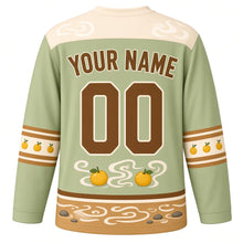 Load image into Gallery viewer, Capybara Hot Spring Original Hockey Jersey in Matcha Sage, back view with your name and number – steam-swirl yoke and yuzu-dot sleeve bands