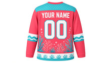 Load image into Gallery viewer, Coral Reef Wonders Original Hockey Jersey in Sunset Coral, back view with your name and number – bubble-dot yoke and wave sleeve stripes