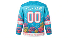 Load image into Gallery viewer, Coral Reef Wonders Original Hockey Jersey in Lagoon Aqua, back view with your name and number – bubble-dot yoke and wave sleeve stripes