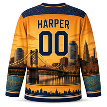 Load image into Gallery viewer, Detroit Bridge Twilight Original Hockey Jersey in Dusk Amber, back view with your name and number over a golden riverfront bridge scene