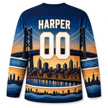 Load image into Gallery viewer, Detroit Bridge Twilight Original Hockey Jersey in Twilight Teal, back view with your name and number over a glowing bridge and brick riverfront