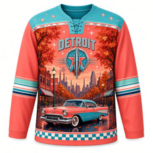 Load image into Gallery viewer, Detroit Tailfin Cruiser Boulevard Original Hockey Jersey in Sunset Coral, front view – 1950s cruiser under autumn maple trees on a brick Midwest boulevard, custom name and number