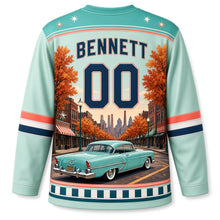 Load image into Gallery viewer, Detroit Tailfin Cruiser Boulevard Original Hockey Jersey in Cruiser Mint, back view with your name and number over a vintage avenue and red-brick shops