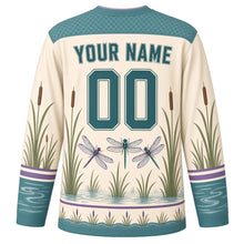 Load image into Gallery viewer, Dragonfly Marsh Original Hockey Jersey in Reed Cream, back view with your name and number – wing-lattice yoke and reed-stripe sleeve bands