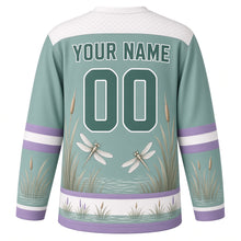 Load image into Gallery viewer, Dragonfly Marsh Original Hockey Jersey in Marsh Teal, back view with your name and number – wing-lattice yoke and reed-stripe sleeve bands
