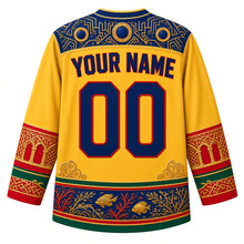 Load image into Gallery viewer, Eritrea Original Hockey Jersey in Dahlak Gold, back view with your name and number – ornate Art Deco geometric yoke, Massawa arcade sleeve bands and Dahlak reef hem band, detailed artwork
