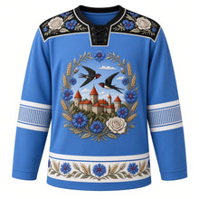 Load image into Gallery viewer, Estonia Original Hockey Jersey in Cornflower Blue, front view – ornate Muhu-embroidered cornflower wreath crest with barn swallows over Tallinn's limestone towers, floral embroidery yoke, detailed artwork, custom name and number