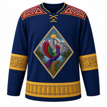 Load image into Gallery viewer, Eswatini Original Hockey Jersey in Lubombo Blue, front view – ornate beaded diamond crest with a purple-crested turaco on Umhlanga reeds before Sibebe Rock, Swazi beadwork yoke, detailed artwork, custom name and number