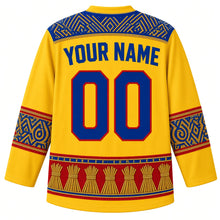 Load image into Gallery viewer, Eswatini Original Hockey Jersey in Umhlanga Gold, back view with your name and number – ornate Swazi beadwork yoke, lutindzi grass-weave sleeve bands and reed-bundle hem band, detailed artwork
