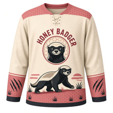Load image into Gallery viewer, Fearless Honey Badger Original Hockey Jersey in Bone Cream, front view – bold honey badger striding through savanna grass with honey badger crest, custom name and number
