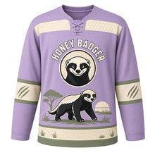 Load image into Gallery viewer, Fearless Honey Badger Original Hockey Jersey in Smoky Lilac, front view – bold honey badger striding through savanna grass with honey badger crest, custom name and number