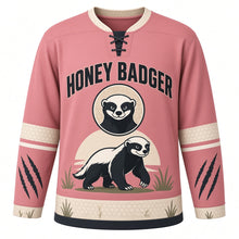 Load image into Gallery viewer, Fearless Honey Badger Original Hockey Jersey in Savanna Rose, front view – bold honey badger striding through savanna grass with honey badger crest, custom name and number