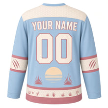 Load image into Gallery viewer, Fearless Honey Badger Original Hockey Jersey in Savanna Sky, back view with your name and number – honeycomb yoke and claw-mark sleeve bands