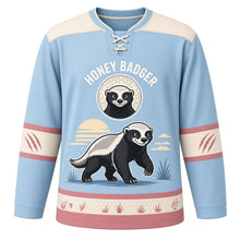Load image into Gallery viewer, Fearless Honey Badger Original Hockey Jersey in Savanna Sky, front view – bold honey badger striding through savanna grass with honey badger crest, custom name and number