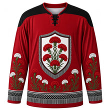 Load image into Gallery viewer, Fiesta de San Isidro Original Hockey Jersey in Carnation Red, front view with themed artwork and clean crest