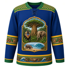 Load image into Gallery viewer, Gabon Original Hockey Jersey in Loango Blue, front view – ornate raffia-weave yoke and okoumé tree crest with mandrill and forest elephant, detailed artwork, custom name and number