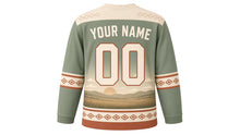 Load image into Gallery viewer, Galloping Horse Prairie Original Hockey Jersey in Prairie Sage, back view with your name and number – western diamond yoke and diamond-stitch sleeve stripes