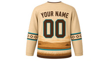 Load image into Gallery viewer, Galloping Horse Prairie Original Hockey Jersey in Desert Sand, back view with your name and number – western diamond yoke and diamond-stitch sleeve stripes