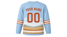 Load image into Gallery viewer, Galloping Horse Prairie Original Hockey Jersey in Big Sky Blue, back view with your name and number – western diamond yoke and diamond-stitch sleeve stripes