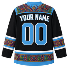 Load image into Gallery viewer, Guatemala Original Hockey Jersey in Obsidian Black, back view with your name and number – ornate multicolor huipil-brocade yoke with diamond, corn and bird hem band, finely detailed artwork