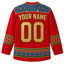 Load image into Gallery viewer, Guinea Original Hockey Jersey in Djembe Red, back view with your name and number – ornate indigo léppi resist-dye yoke with rope-lacing chevron and indigo-circle bands, finely detailed artwork
