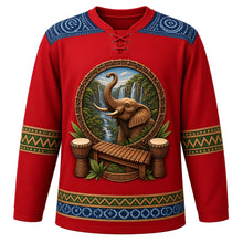Load image into Gallery viewer, Guinea Original Hockey Jersey in Djembe Red, front view – ornate elephant before Fouta Djallon waterfalls with djembes and balafon, indigo léppi yoke, detailed illustrated artwork, custom name and number
