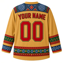 Load image into Gallery viewer, Guinea Original Hockey Jersey in Savanna Gold, back view with your name and number – ornate indigo léppi resist-dye yoke with rope-lacing chevron and indigo-circle bands, finely detailed artwork
