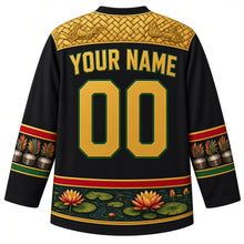 Load image into Gallery viewer, Guyana Original Hockey Jersey in Kaieteur Black, back view with your name and number – Amerindian basketry-weave yoke, steelpan-and-feather sleeve bands and Victoria lily hem, detailed artwork