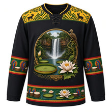 Load image into Gallery viewer, Guyana Original Hockey Jersey in Kaieteur Black, front view – Kaieteur Falls and Victoria lily crest with hoatzin, ornate Amerindian basketry-weave yoke, detailed artwork, custom name and number