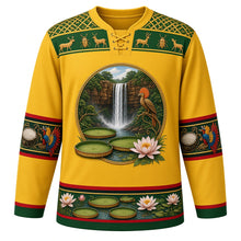 Load image into Gallery viewer, Guyana Original Hockey Jersey in Rupununi Gold, front view – Kaieteur Falls and Victoria lily crest with hoatzin, ornate Amerindian basketry-weave yoke, detailed artwork, custom name and number