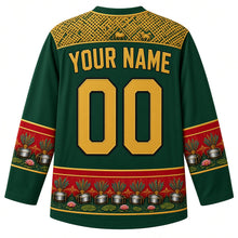 Load image into Gallery viewer, Guyana Original Hockey Jersey in Rainforest Green, back view with your name and number – Amerindian basketry-weave yoke, steelpan-and-feather sleeve bands and Victoria lily hem, detailed artwork