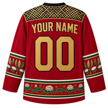 Load image into Gallery viewer, Guyana Original Hockey Jersey in Mashramani Red, back view with your name and number – Amerindian basketry-weave yoke, steelpan-and-feather sleeve bands and Victoria lily hem, detailed artwork
