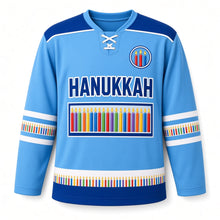 Load image into Gallery viewer, Candle Box Rainbow Hanukkah Hockey Jersey in Candlebox Sky, front view – custom name and number
