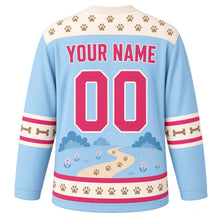 Load image into Gallery viewer, Happy Corgi Trails Original Hockey Jersey in Sky Blue, back view with your name and number – paw-print yoke and bone-stripe sleeve bands